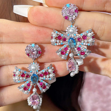 Bow colored diamond earrings